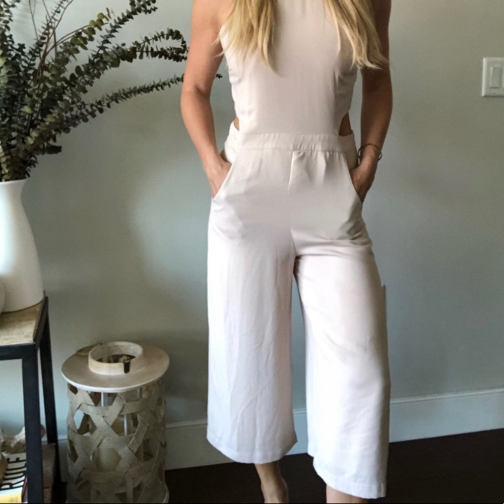 Cropped beige jumpsuit with cutouts